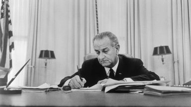 (Original Caption) The White House released this photo 1/25 of President Johnson signing the Executive Order ordering certain units of the Ready Reserve of the Naval Reserve Air Force Reserve and Air National Guard of the U.S. to active duty.