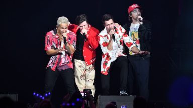  (L-R) L Carlos PenaVega, James Maslow, and Kendall Schmidt of Big Time Rush perform onstage during iHeartRadio 93.3 FLZ’s Jingle Ball 2022 Presented by Capital One at Amalie Arena on December 16, 2022 in Tampa, Florida. (Photo by Gerardo Mora/Getty Images for iHeartRadio)