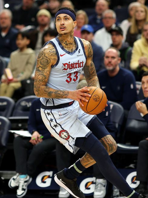 MINNEAPOLIS, MINNESOTA - FEBRUARY 01: Kyle Kuzma #33 of the Washington Wizards dribbles the ball against the Minnesota Timberwolves in the fourth quarter at Target Center on February 01, 2025 in Minneapolis, Minnesota. The Wizards defeated the Timberwolves 105-103. NOTE TO USER: User expressly acknowledges and agrees that, by downloading and or using this photograph, User is consenting to the terms and conditions of the Getty Images License Agreement. (Photo by David Berding/Getty Images)