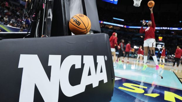MINNEAPOLIS, MINNESOTA - APRIL 03: The NCAA logo and a game ball as the South Carolina Gamecocks warm-up before the game against the UConn Huskies during the 2022 NCAA Women's Basketball Tournament National Championship game at Target Center on April 03, 2022 in Minneapolis, Minnesota. (Photo by Andy Lyons/Getty Images)