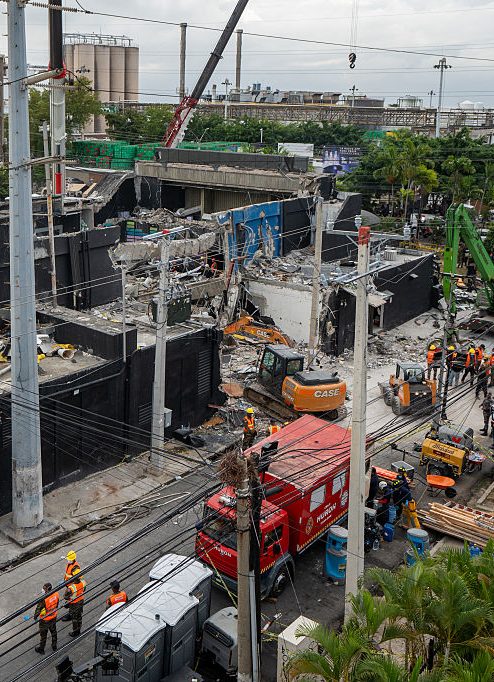 Rescue teams work at the Jet Set nightclub a day after the collapse of its roof in Santo Domingo on April 9, 2025. Rescuers raced to find survivors among the rubble of the nightclub where at least 113 people, including a former Major League Baseball star, were killed when the roof collapsed. (Photo by Francesco SPOTORNO / AFP) (Photo by FRANCESCO SPOTORNO/AFP via Getty Images)