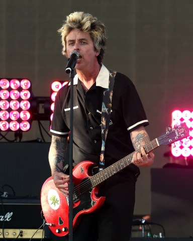 INDIO, CALIFORNIA - APRIL 11: (FOR EDITORIAL USE ONLY) (L-R) Billie Joe Armstrong performs with The Go-Go's at the Outdoor Theatre during the 2025 Coachella Valley Music and Arts Festival at Empire Polo Club on April 11, 2025 in Indio, California. (Photo by Frazer Harrison/Getty Images for Coachella)