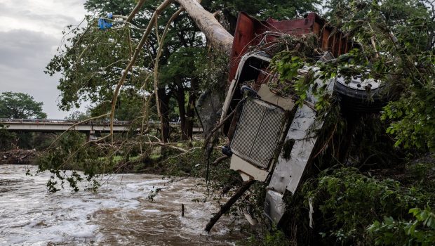 CENTER POINT, TEXAS - JULY 5: A large truck is impaled onto a tree after flash flooding on the bank Guadalupe River on July 5, 2025 in Center Point, Texas. Heavy rainfall caused flooding along the Guadalupe River in central Texas with multiple fatalities reported. (Photo by Jim Vondruska/Getty Images)