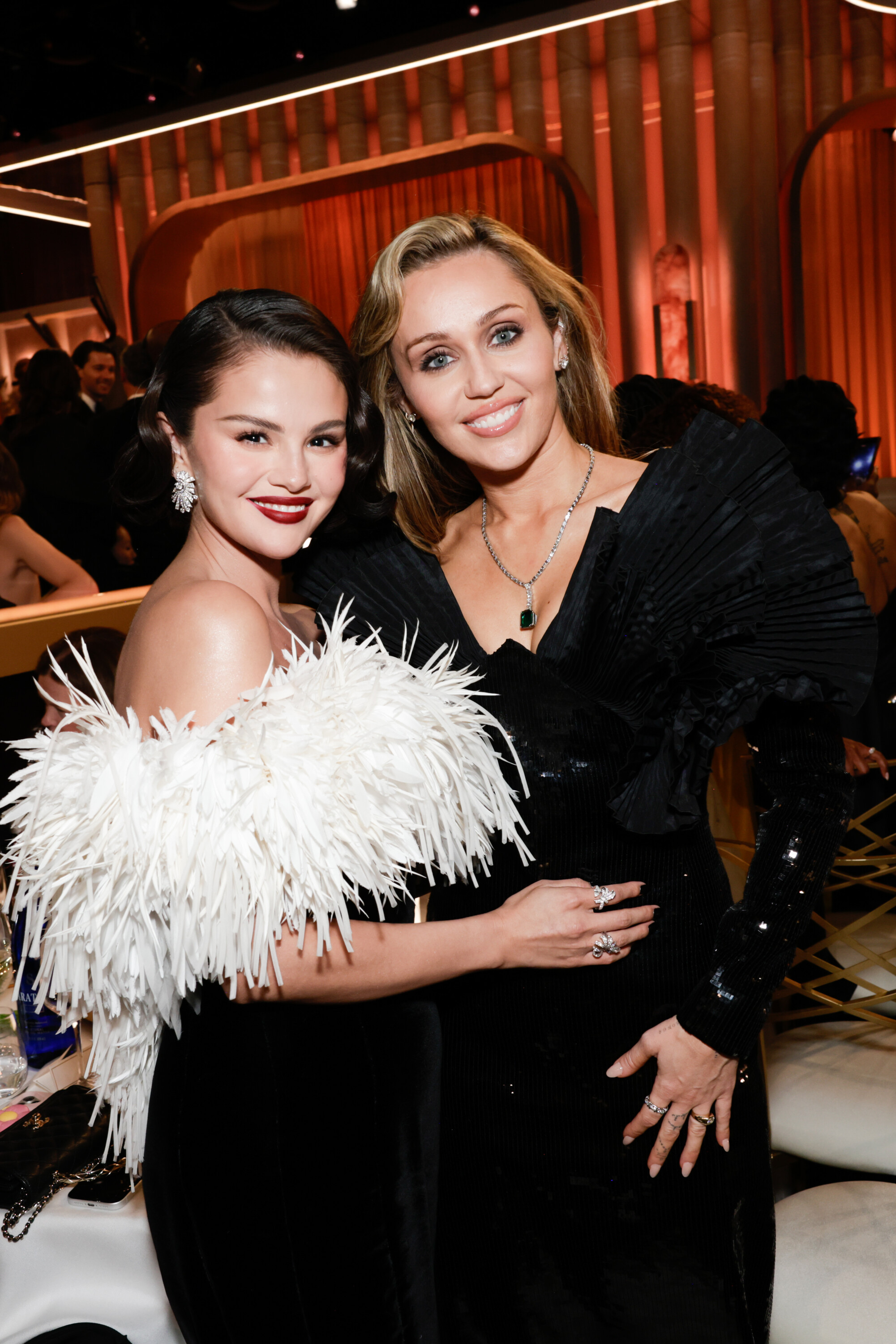 Selena Gomez and Miley Cyrus at the 83RD ANNUAL GOLDEN GLOBES®, airing live from the Beverly Hilton in Beverly Hills, California on Sunday, January 11, 2026 at 8 PM ET/5 PM PT, on CBS and streaming on Paramount+. Photo: Francis Specker/CBS ©2026 CBS Broadcasting, Inc. All Rights Reserved.