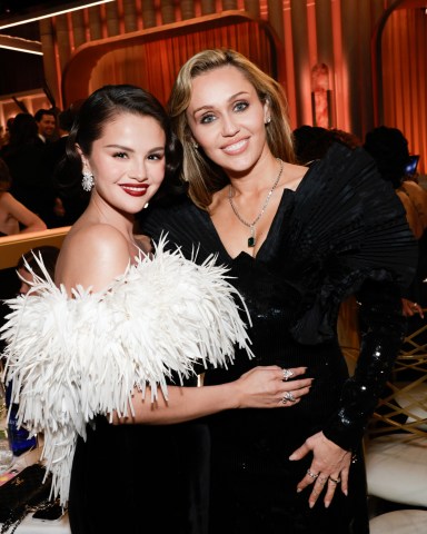 Selena Gomez and Miley Cyrus at the 83RD ANNUAL GOLDEN GLOBES®, airing live from the Beverly Hilton in Beverly Hills, California on Sunday, January 11, 2026 at 8 PM ET/5 PM PT, on CBS and streaming on Paramount+. Photo: Francis Specker/CBS ©2026 CBS Broadcasting, Inc. All Rights Reserved.
