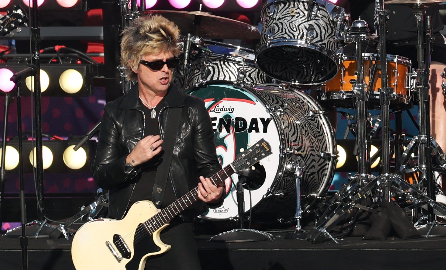 US musician Billie Joe Armstrong from rock band Green Day performs during the opening ceremony ahead of Super Bowl LX between the New England Patriots and Seattle Seahawks at Levi's Stadium in Santa Clara, California on February 8, 2026. (Photo by Patrick T. Fallon / AFP via Getty Images)