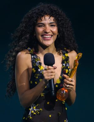MANCHESTER, ENGLAND - FEBRUARY 28: (EDITORIAL USE ONLY) Olivia Dean accepts Artist of the Year Award on stage during The BRIT Awards 2026 at Co-op Live on February 28, 2026 in Manchester, England. (Photo by Karwai Tang/WireImage)