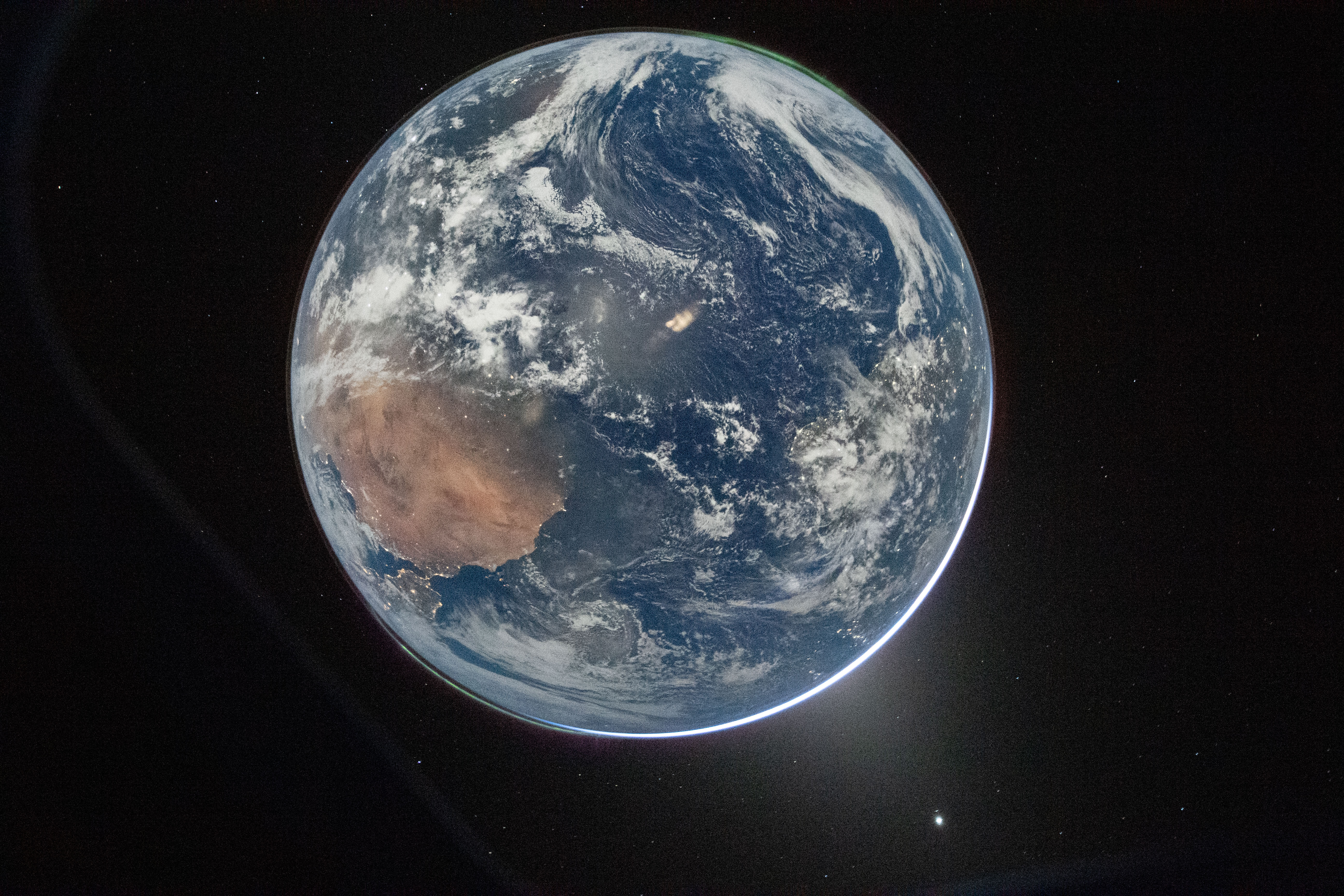 Artemis 2 Photos: Pictures of the Moon, Earthset, Eclipse & More a view of Earth taken by NASA astronaut and Artemis II commander Reid Wiseman from the Orion spacecraft's window after completing the translunar injection burn on April 2, 2026.