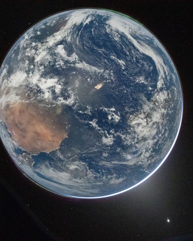 Artemis 2 Photos: Pictures of the Moon, Earthset, Eclipse & More a view of Earth taken by NASA astronaut and Artemis II commander Reid Wiseman from the Orion spacecraft's window after completing the translunar injection burn on April 2, 2026.