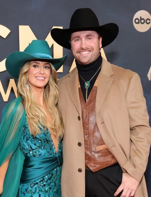 NASHVILLE, TENNESSEE - NOVEMBER 19: EDITORIAL USE ONLY (L-R) Lainey Wilson and Devlin "Duck" Hodges attend the 59th Annual Country Music Association Awards at Music City Center on November 19, 2025 in Nashville, Tennessee. (Photo by Emma McIntyre/Getty Images)