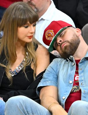 CLEVELAND, OHIO - MAY 23: Travis Kelce (R) of the Kansas City Chiefs reacts as Singer Taylor Swift (L) looks on during the fourth quarter in Game Three between the New York Knicks and the Cleveland Cavaliers in the NBA Eastern Conference Finals at Rocket Arena on May 23, 2026 in Cleveland, Ohio. NOTE TO USER: User expressly acknowledges and agrees that, by downloading and or using this photograph, User is consenting to the terms and conditions of the Getty Images License Agreement. (Photo by Jason Miller/Getty Images)